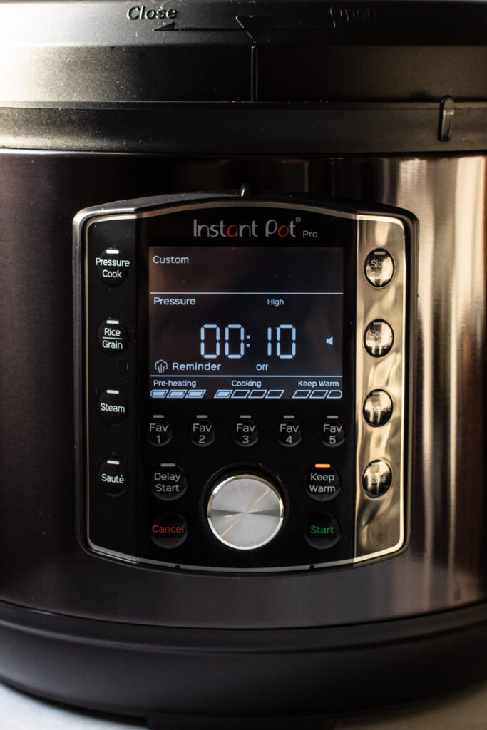 An instant pot with ten minutes on the timer.