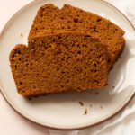 Two slices of whole wheat pumpkin bread.