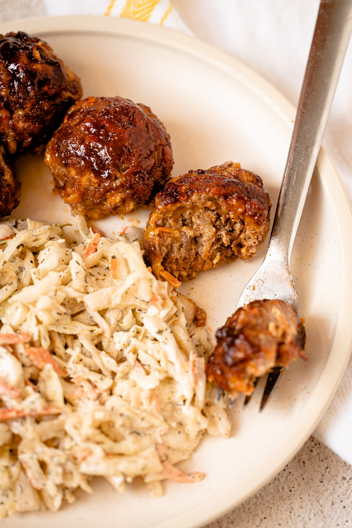 BBQ cheddar meatballs on a plate.