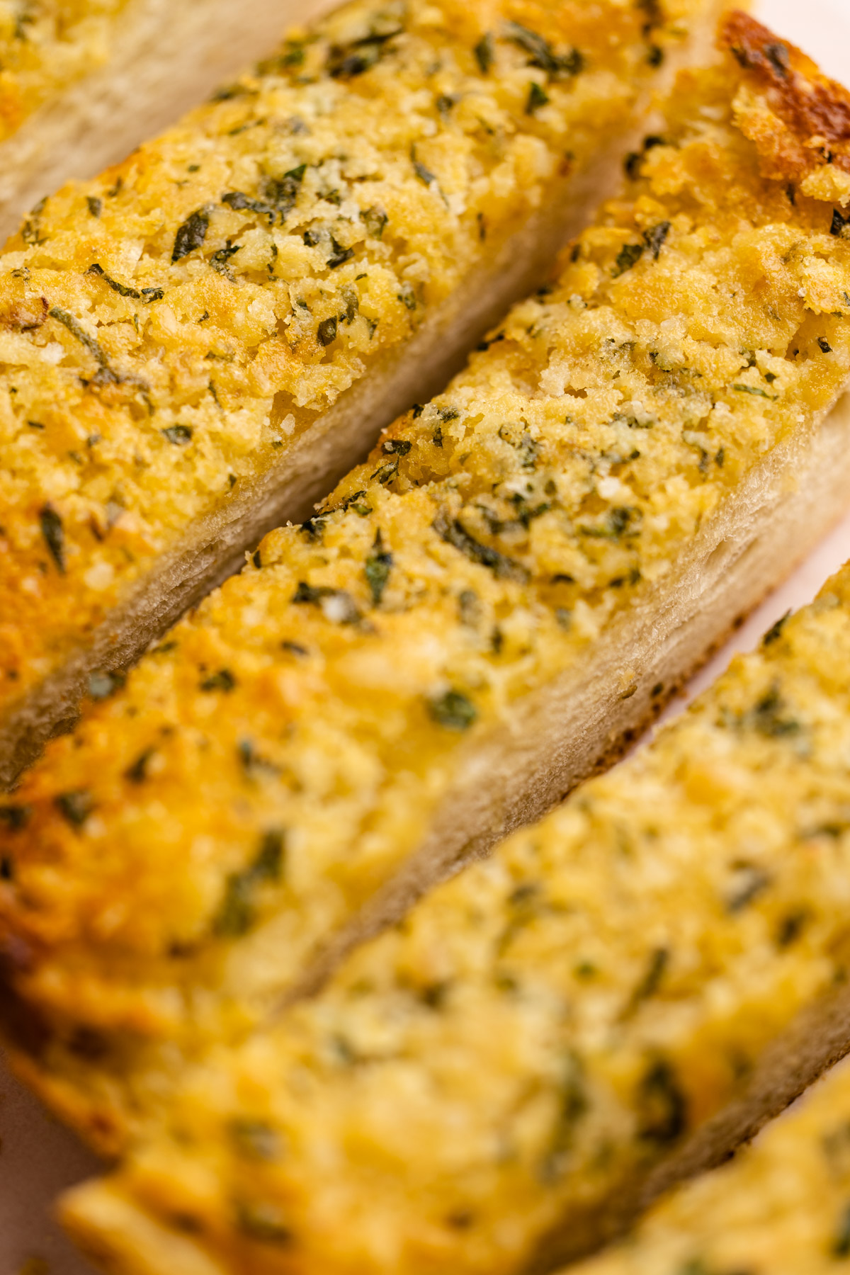 Buttery garlic bread sliced thinly.