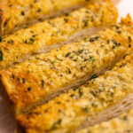 Slices of buttery garlic bread.