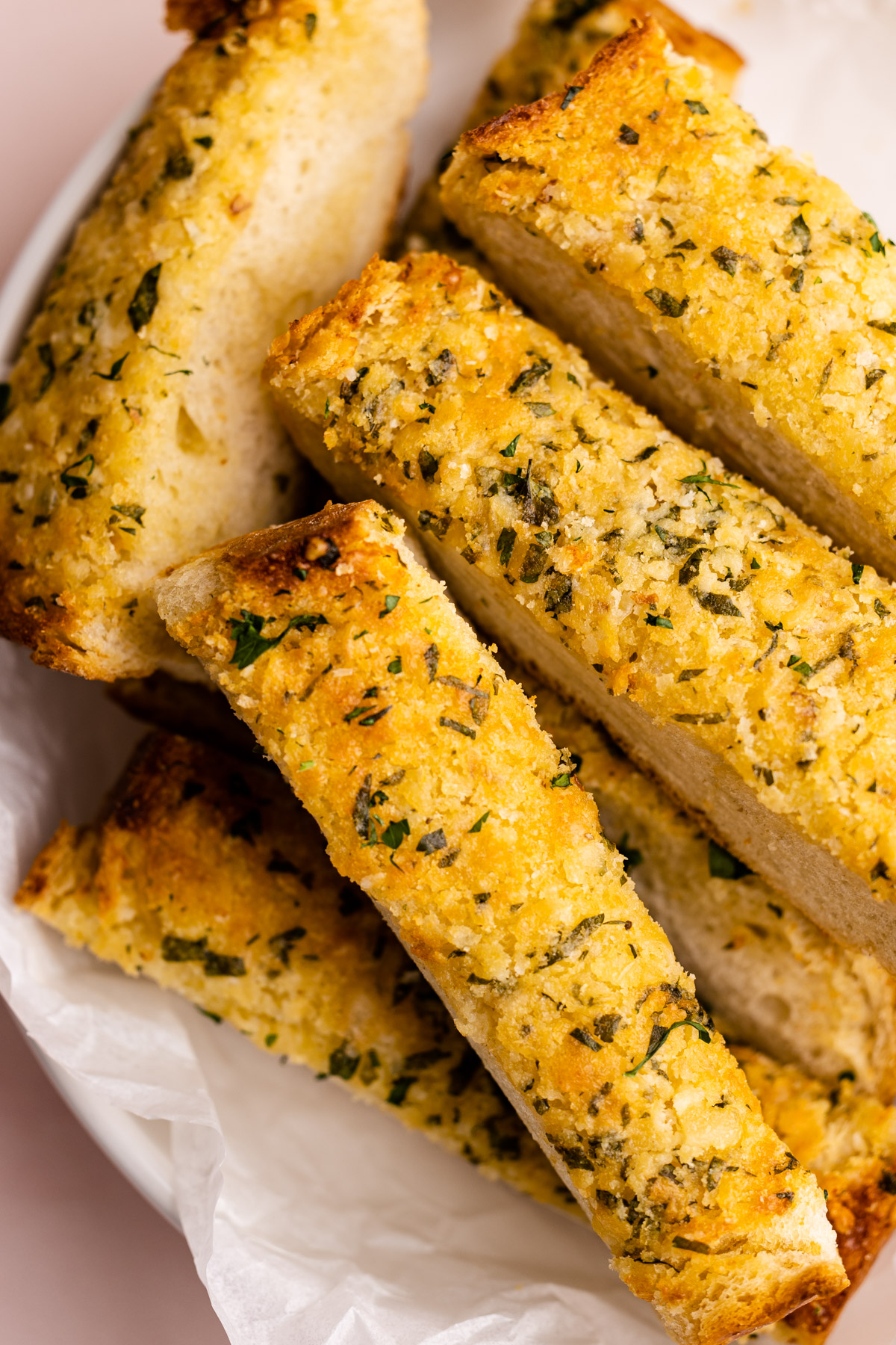 A bowl of quick homemade garlic bread pieces.