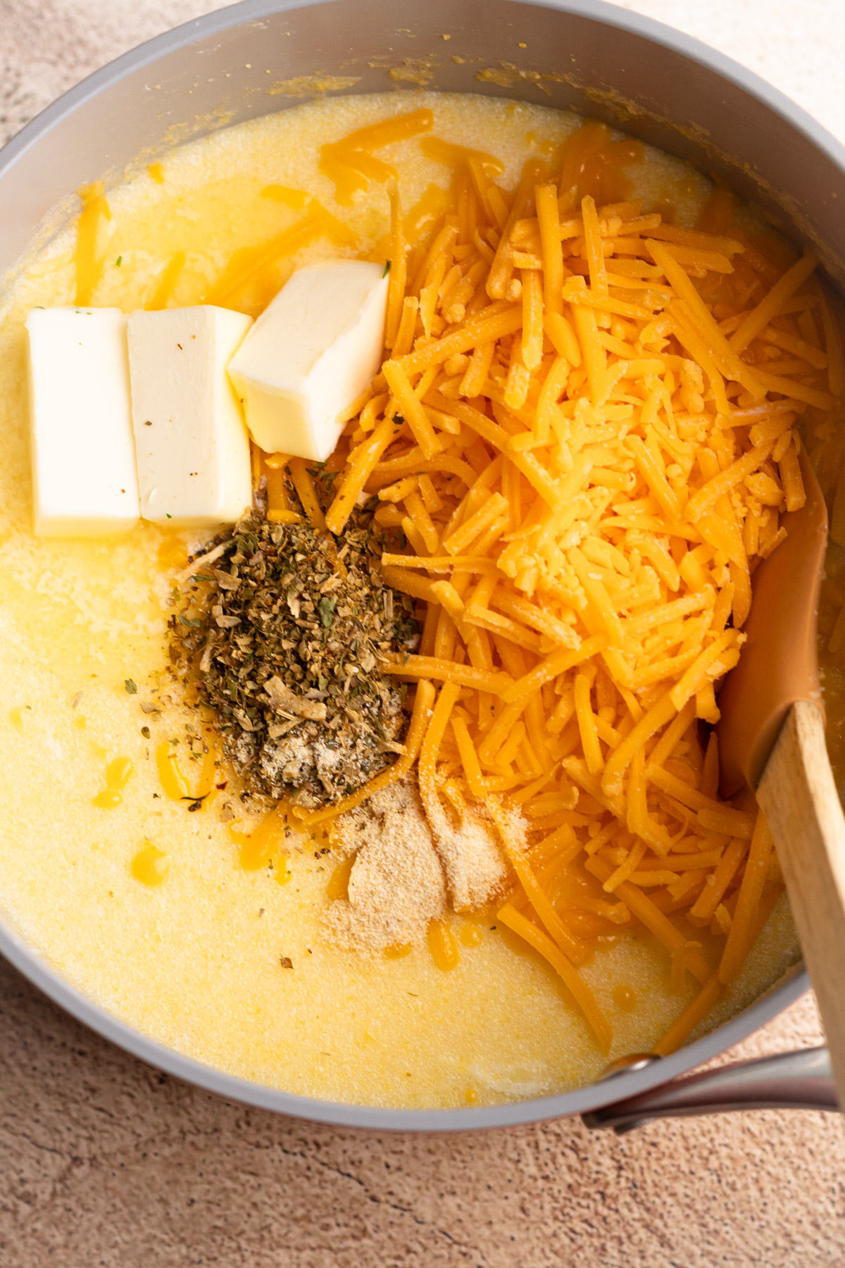 Ingredients in a bowl for cheesy instant polenta.