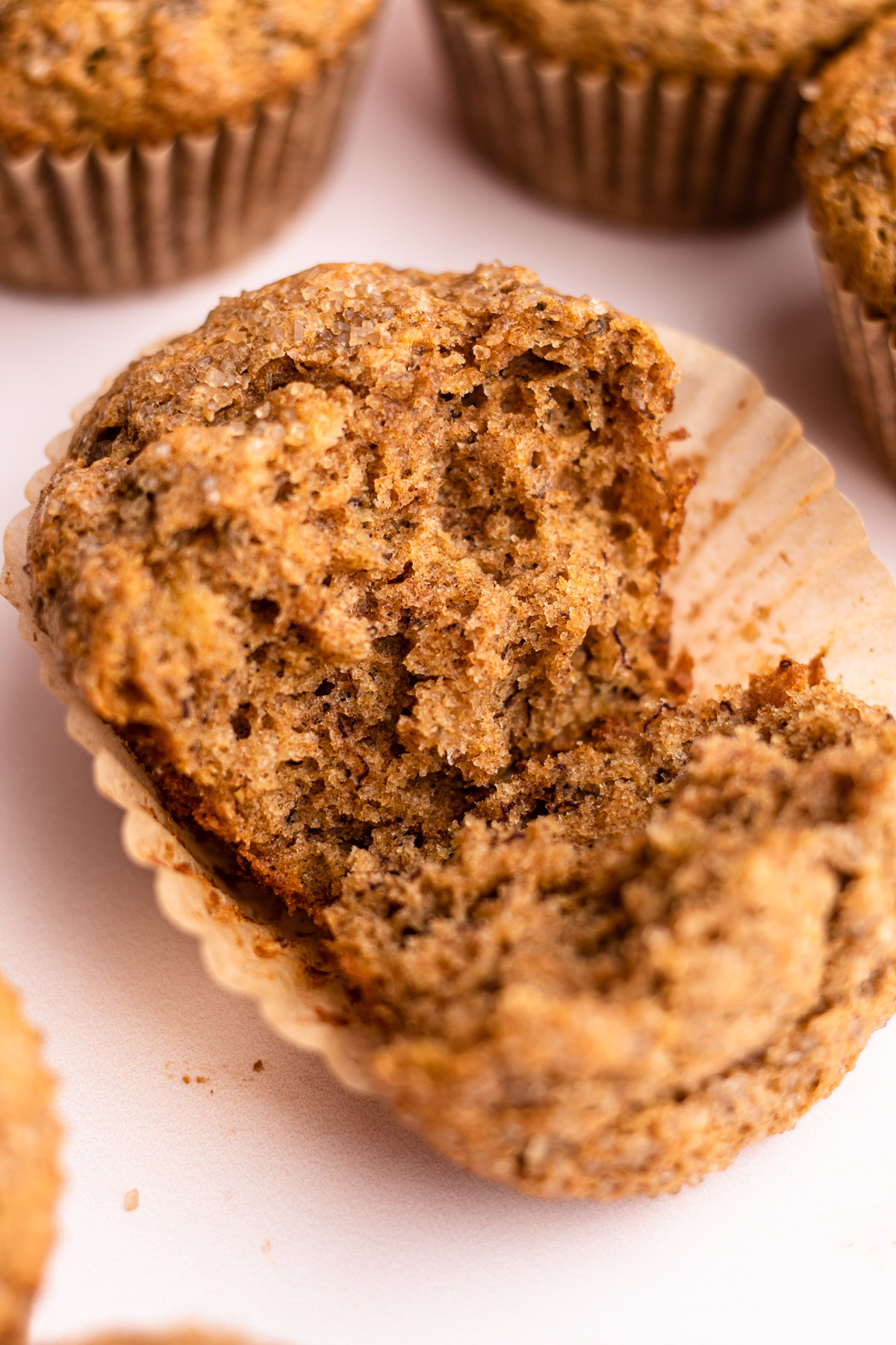 A broken open whole wheat banana muffin.