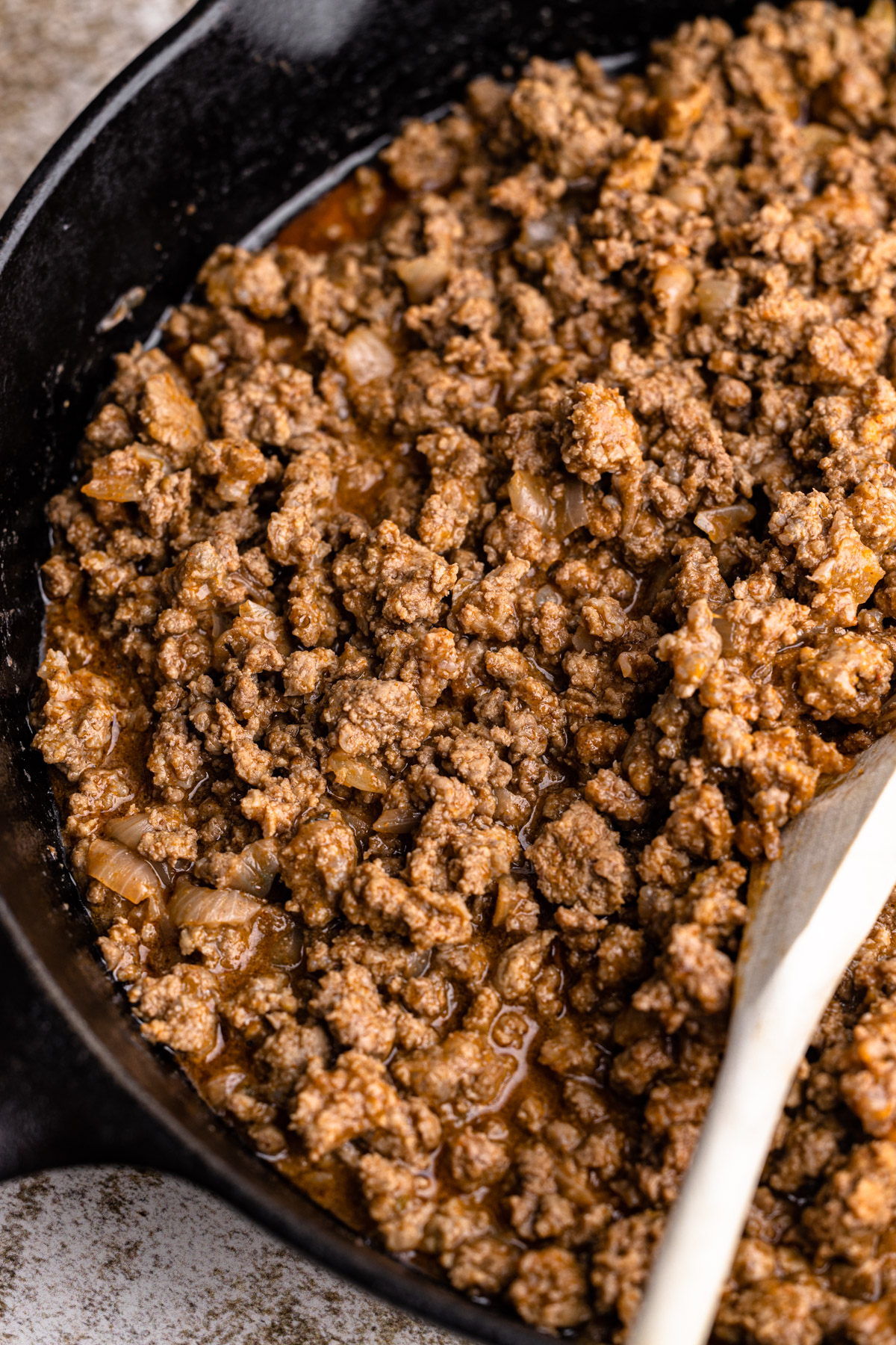 Ground beef cooked in a skillet.