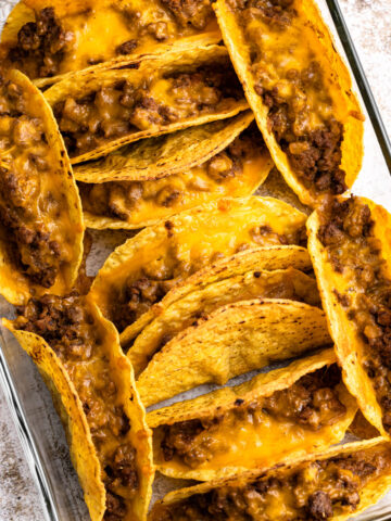 Oven tacos with beef and melty cheese.