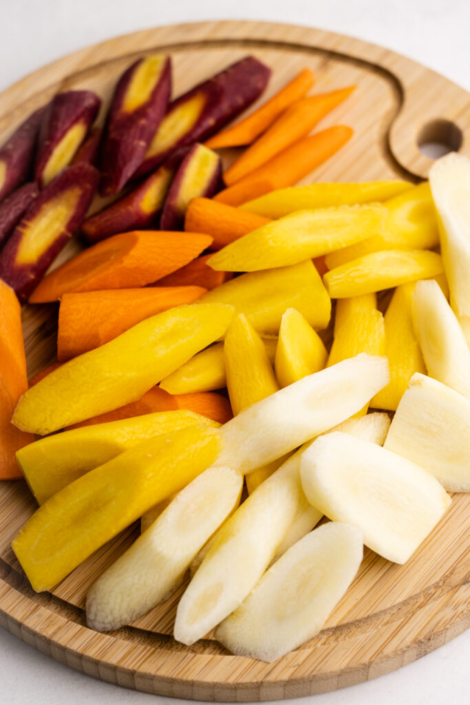 A cutting board of carrots.