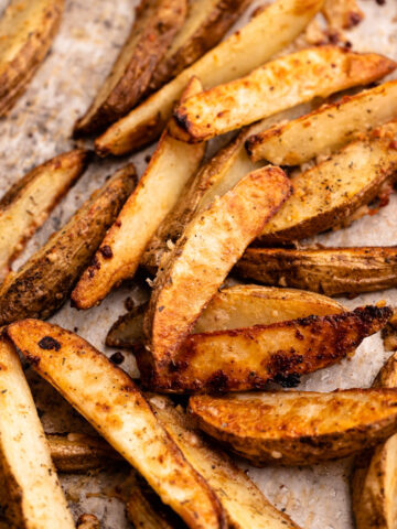A tray of parmesan roasted potato wedges.