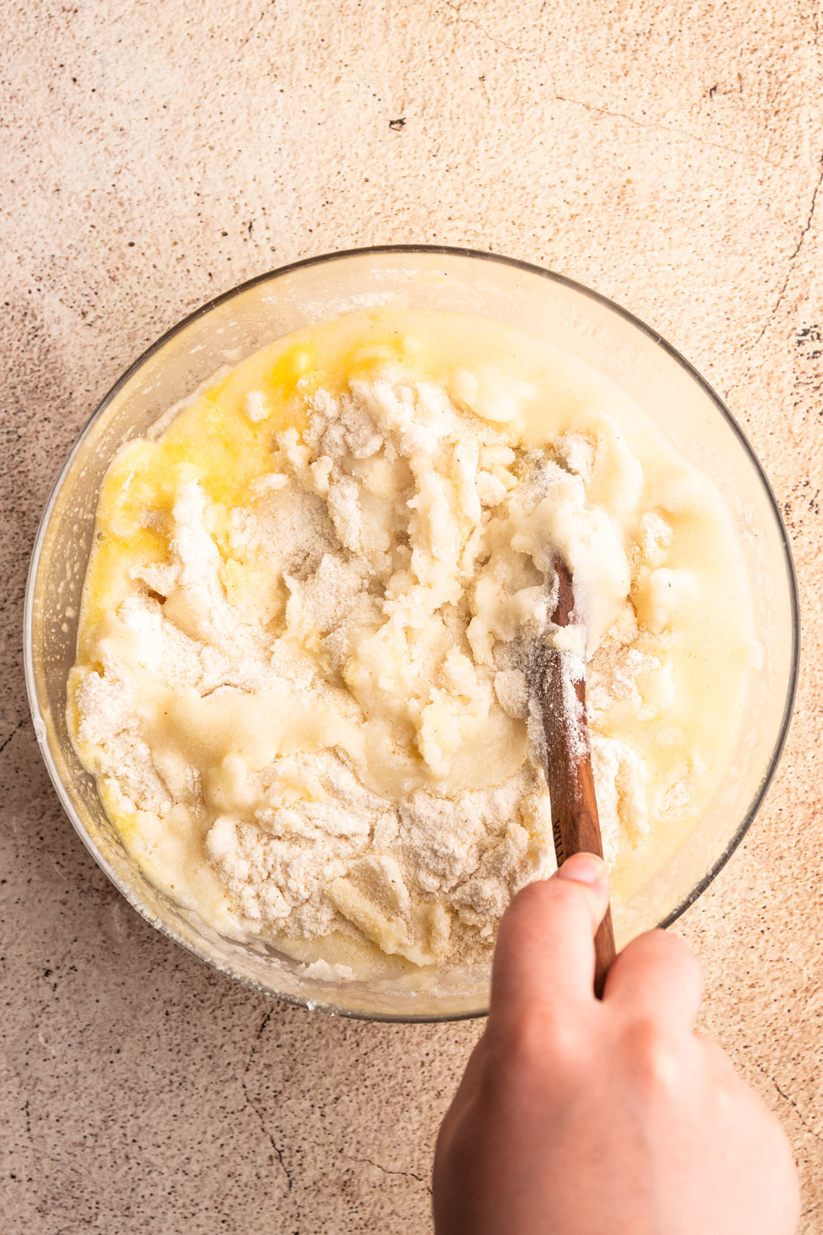 Mixing arepa dough.