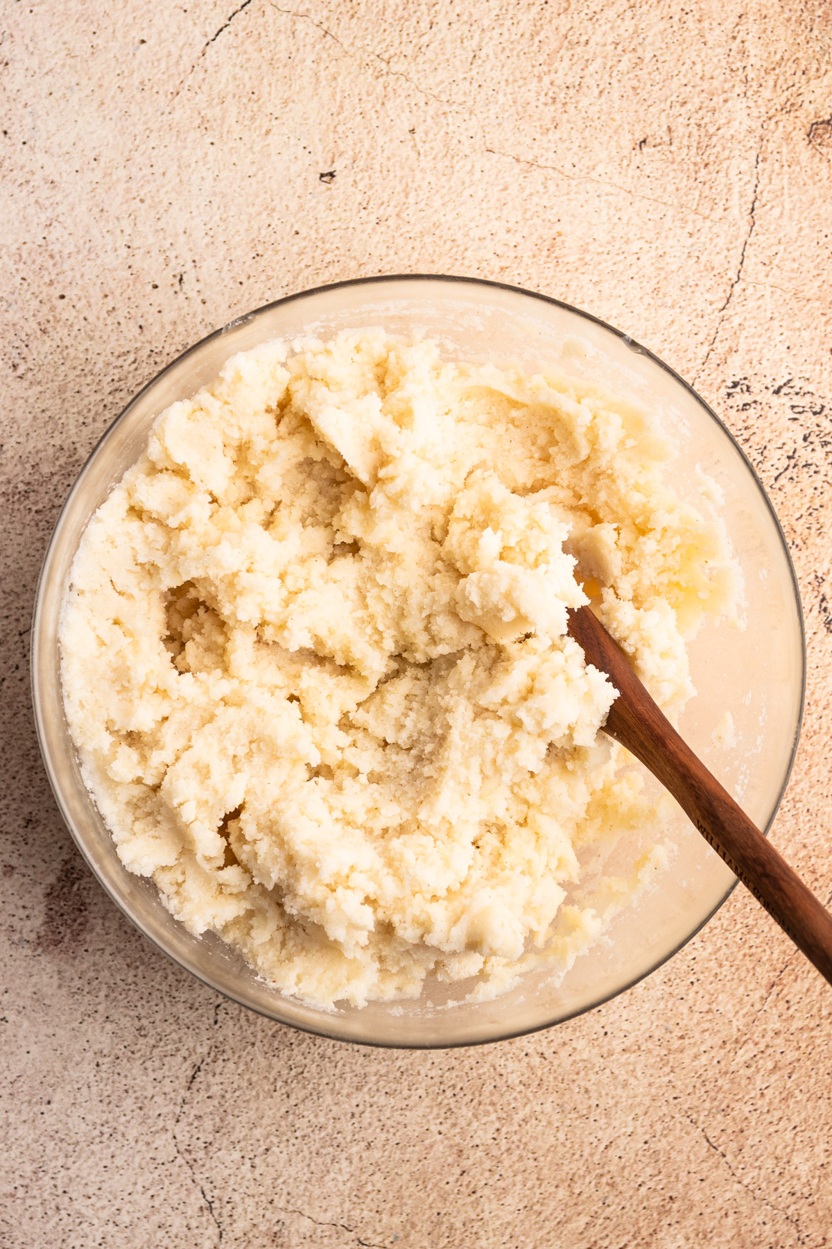 Mixing arepa dough.