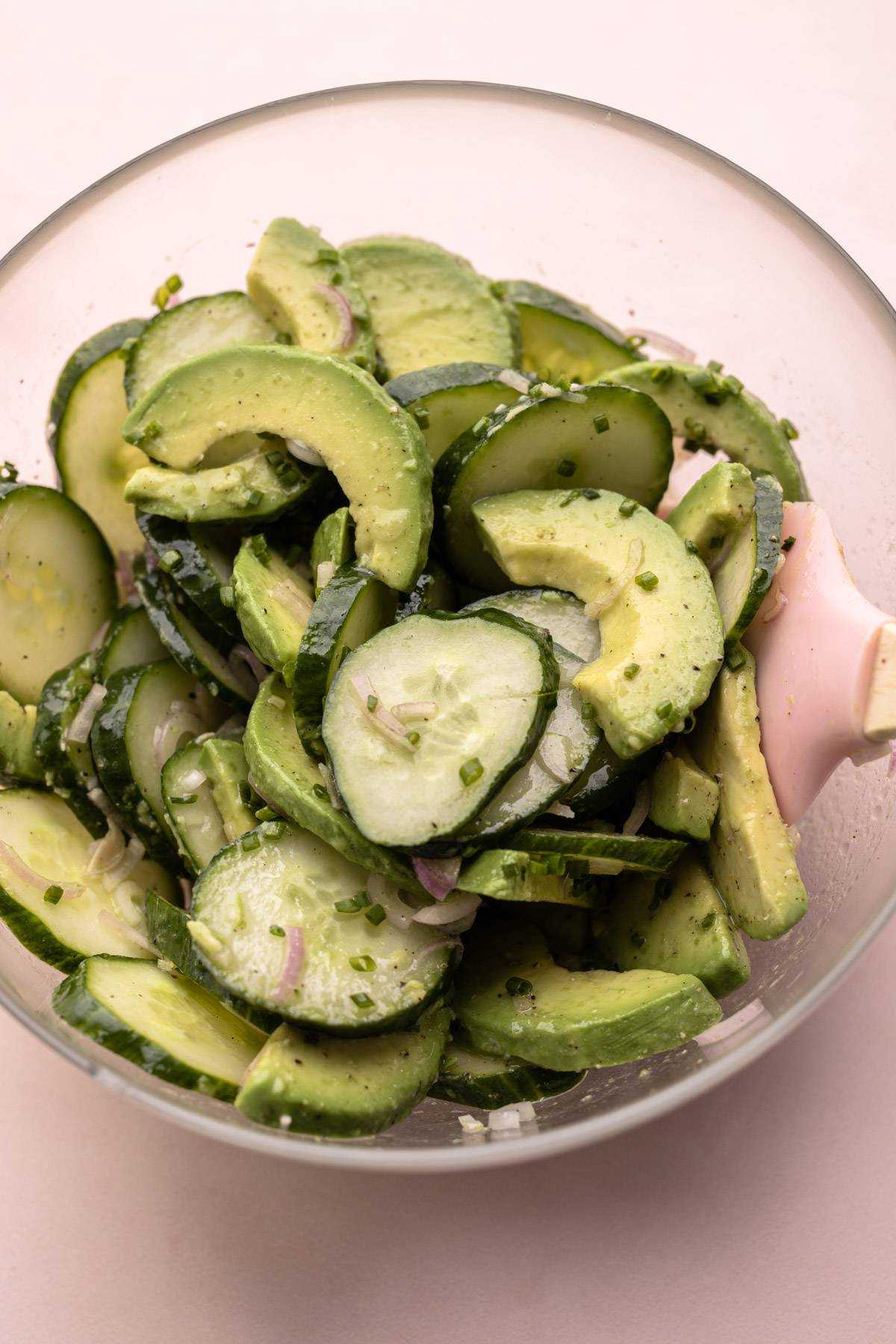 A bowl of cucumber avocado salad.