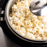 An instant pot full of popped popcorn.