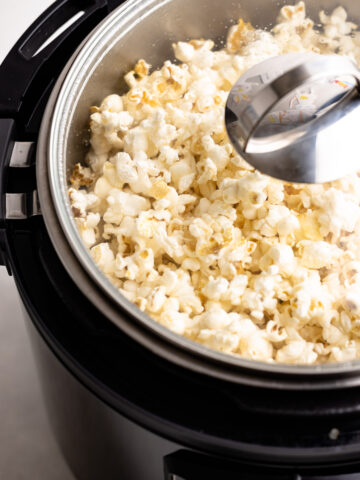 An instant pot full of popped popcorn.
