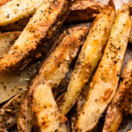 A tray of parmesan roasted potato wedges.