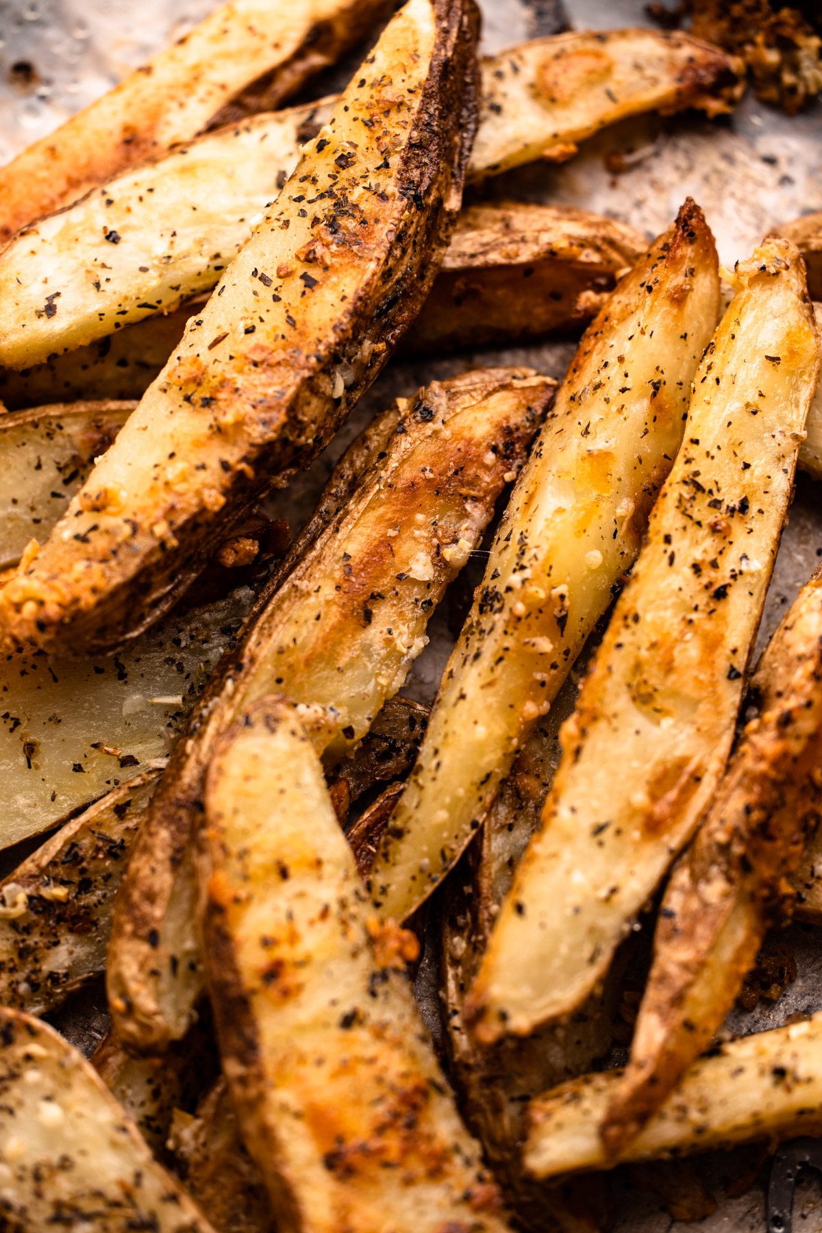 A tray of parmesan roasted potato wedges.