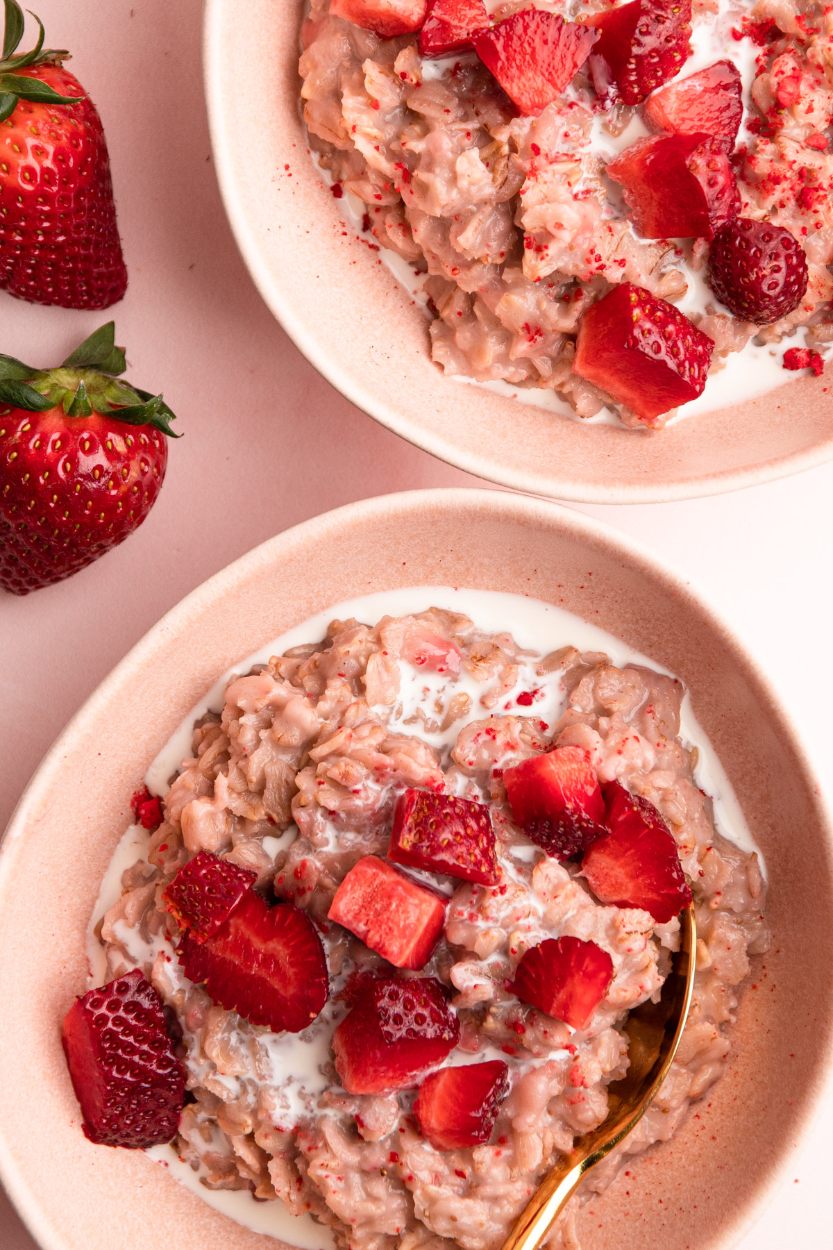 Two bowls of strawberry oatmeal.