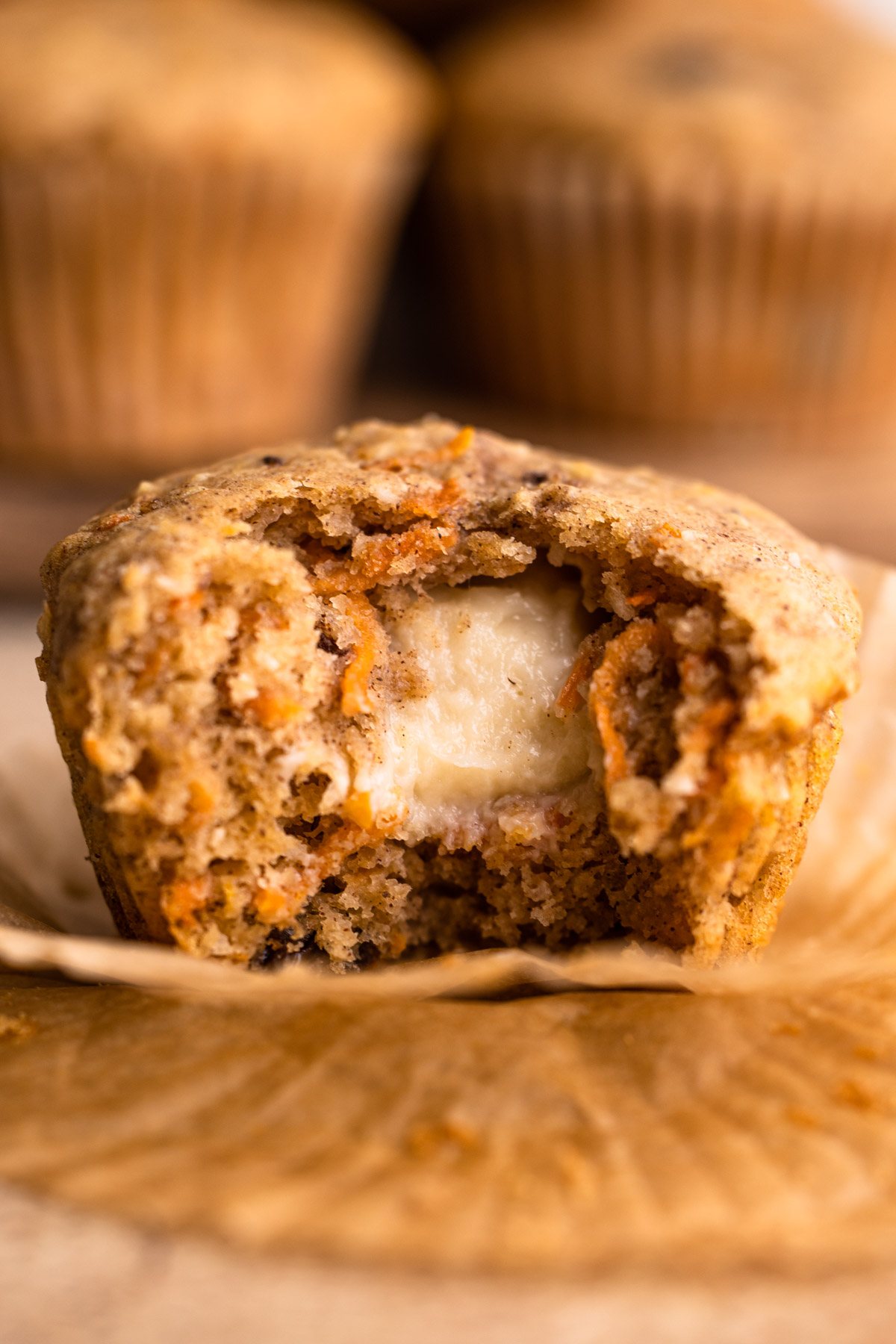 A cream cheese stuffed carrot cake muffin.