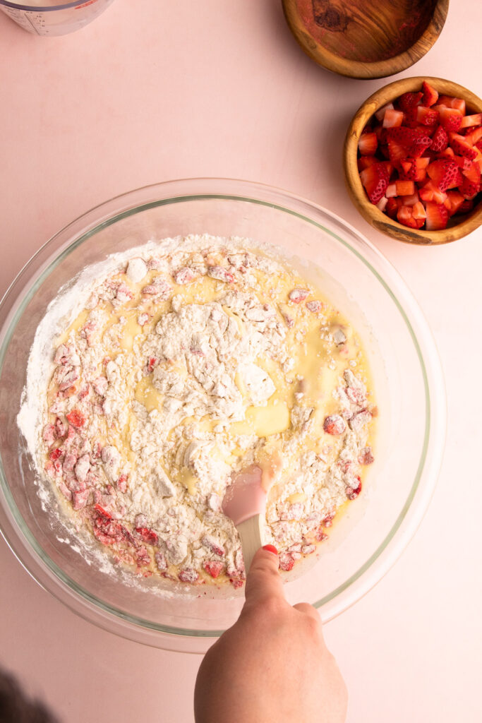 Mixing strawberry muffin batter.