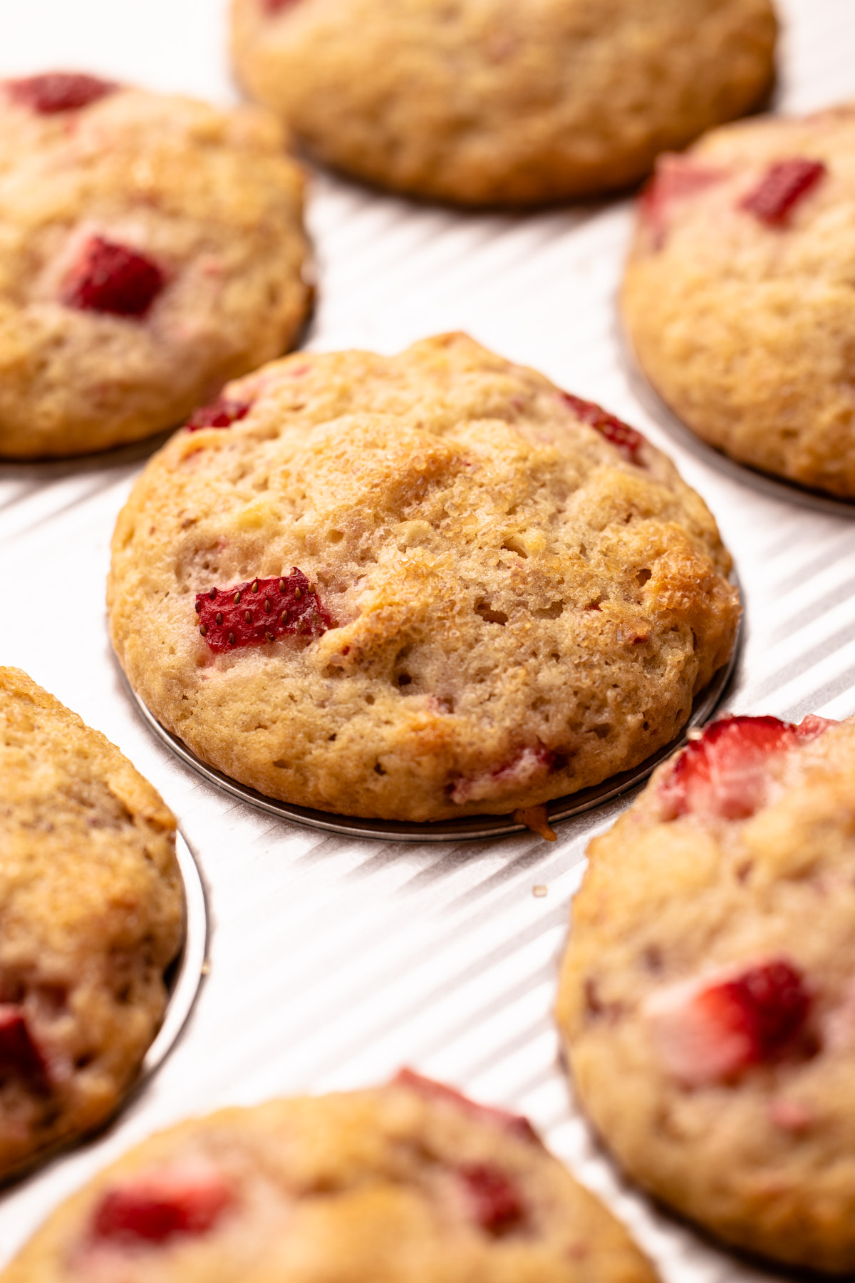 Strawberry Muffins in a muffin tin.