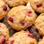 Buttermilk Strawberry Muffins on a cooling rack.