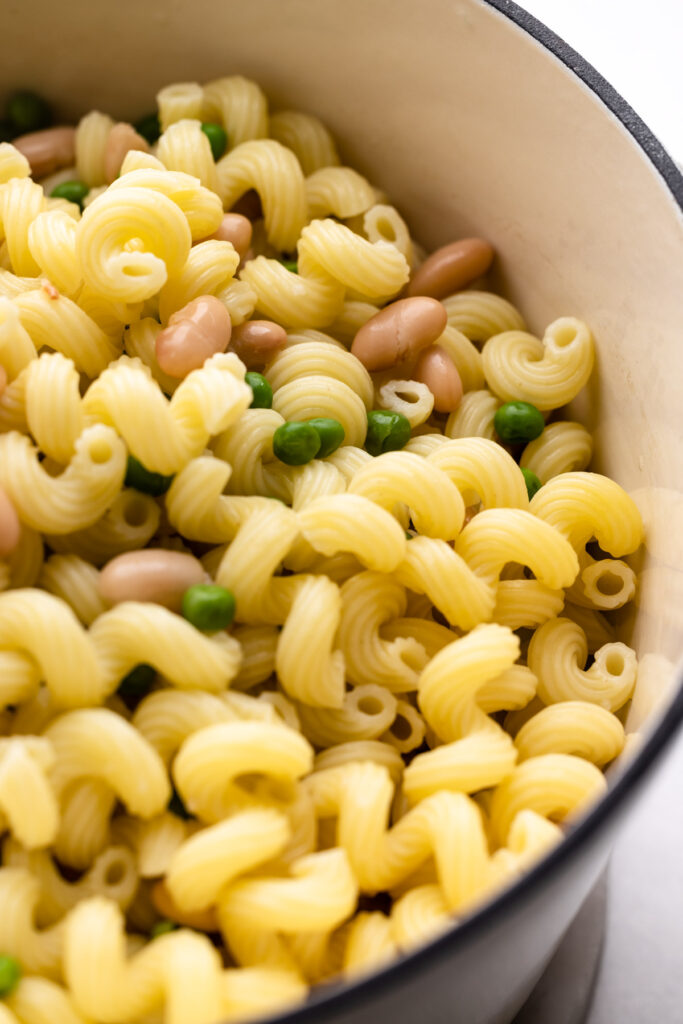 Cooked pasta with peas and beans.