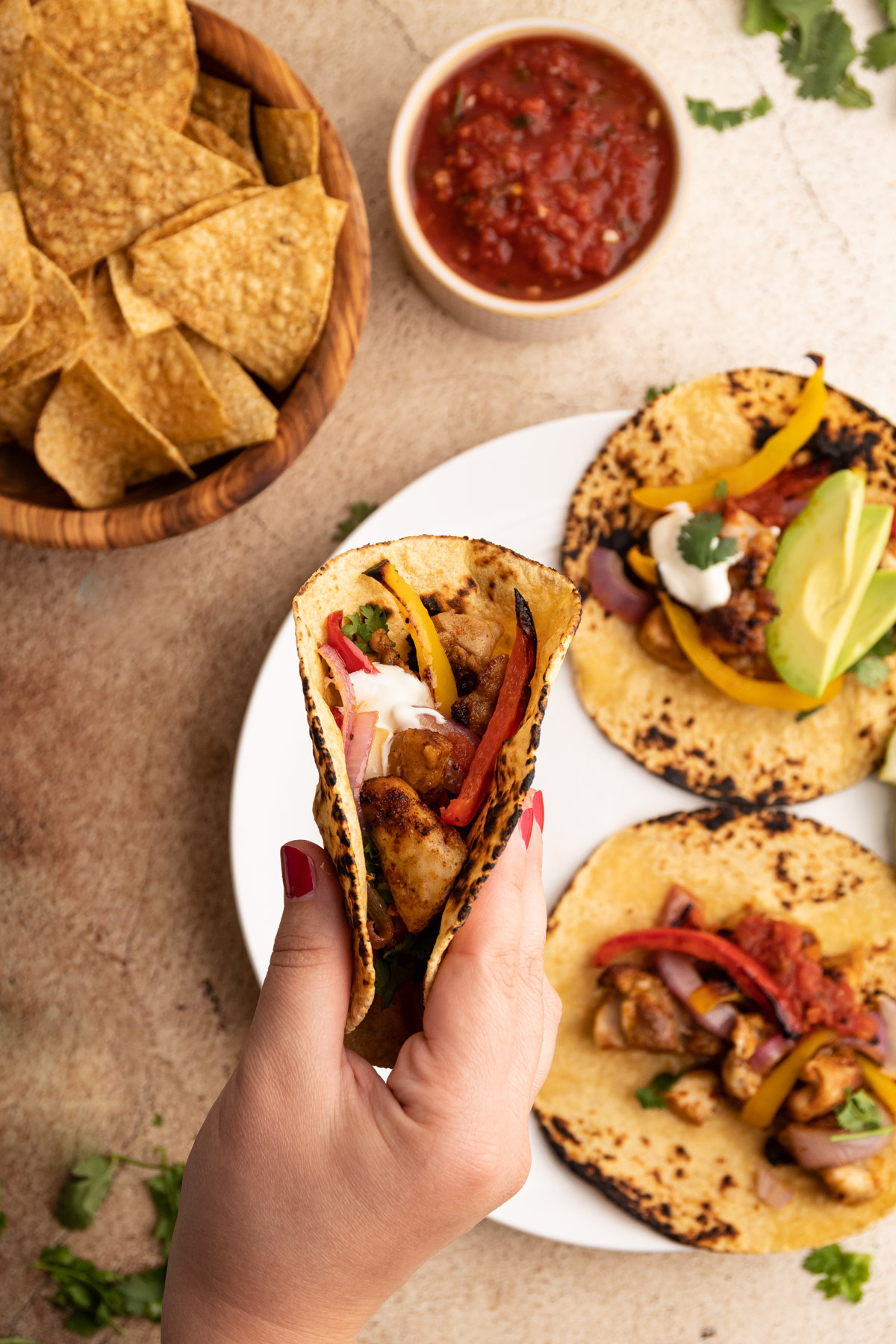 Sheetpan chicken fajitas served on a plate.