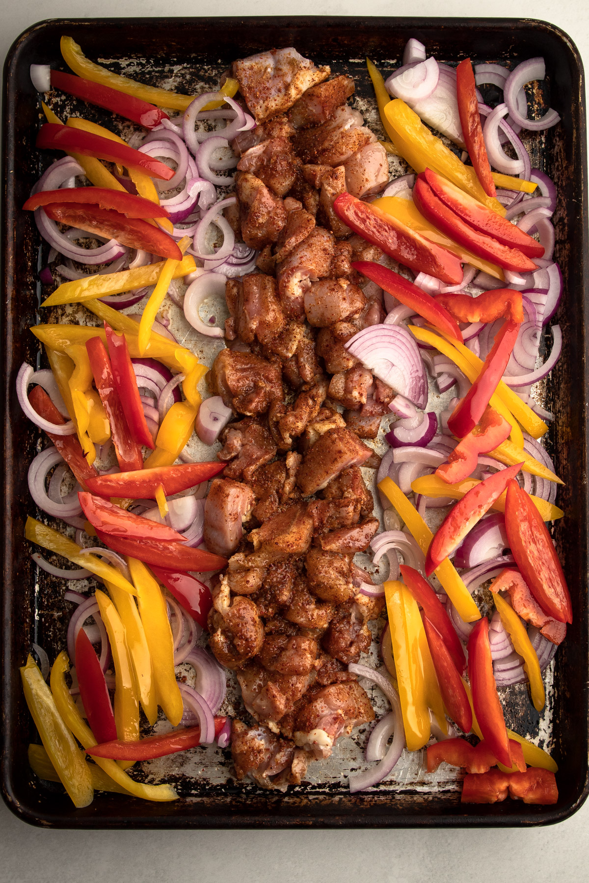 Uncooked sheet pan chicken fajitas 