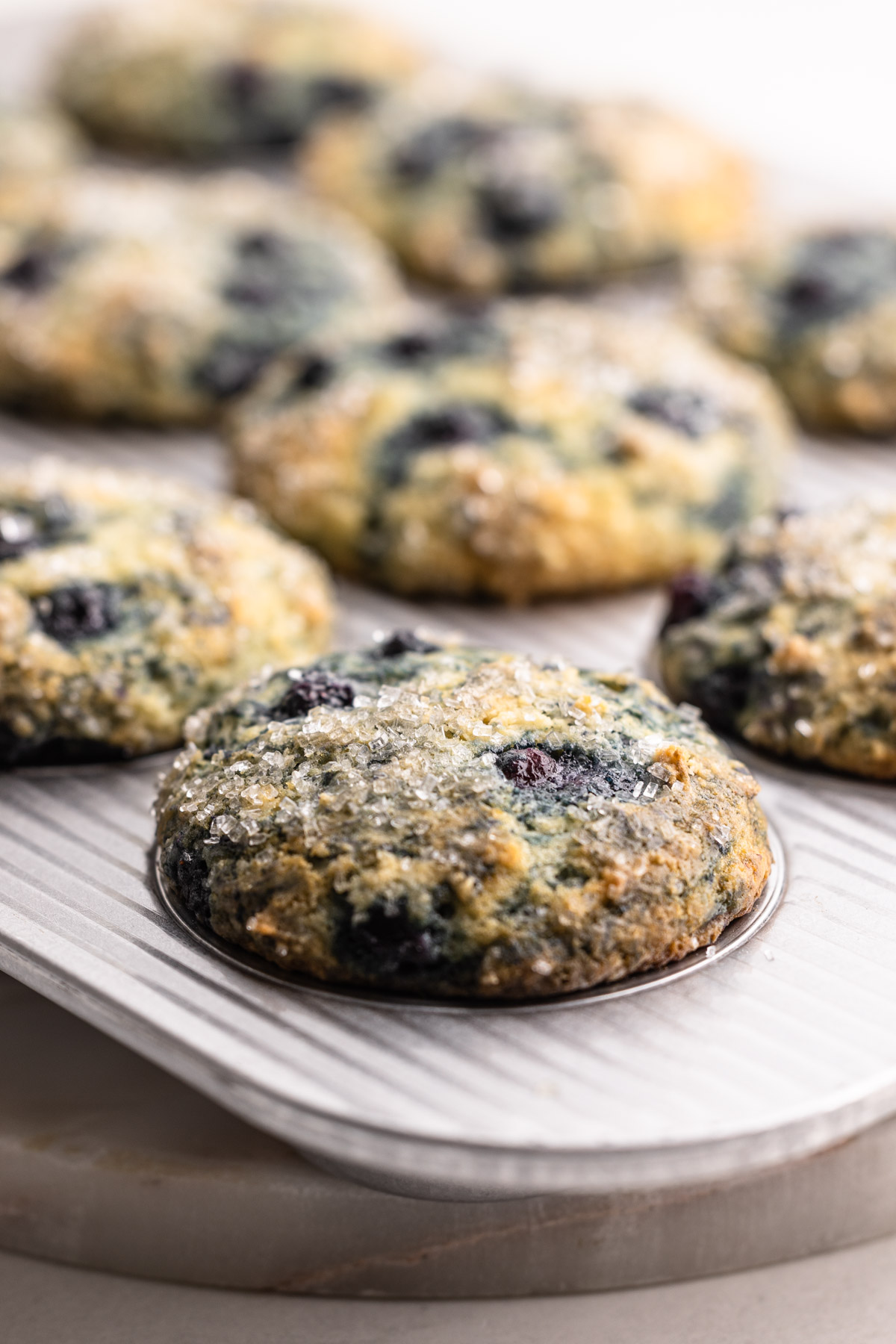 Greek yogurt blueberry muffins baked in a muffin tin.