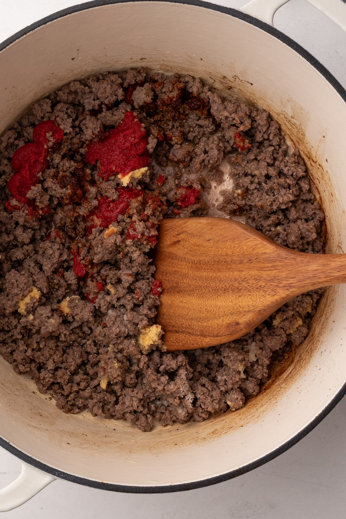 Cooking the beef for hamburger helper.