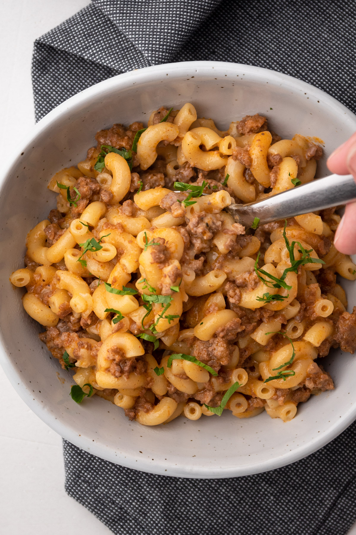 A serving bowl of cheesy ground beef hamburger helper
