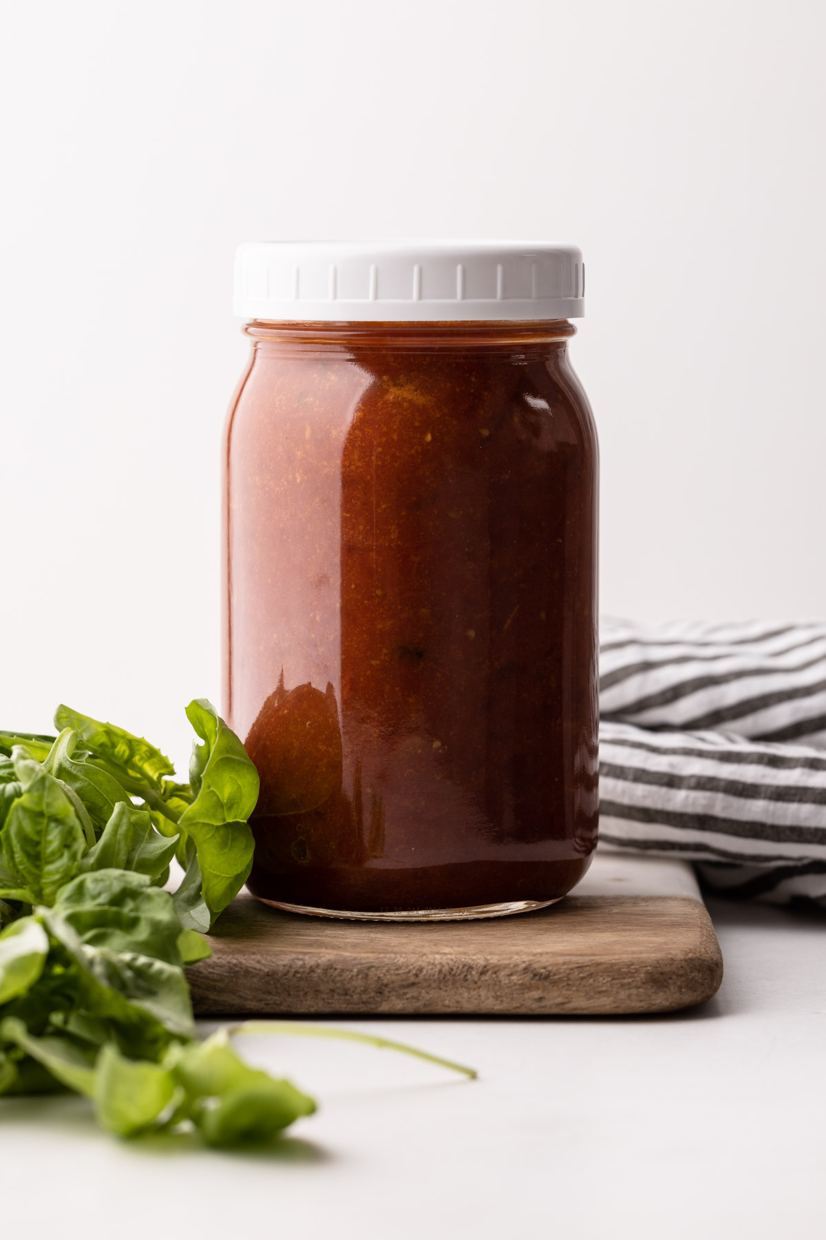 A jar of tomato sauce made in the slow cooker.