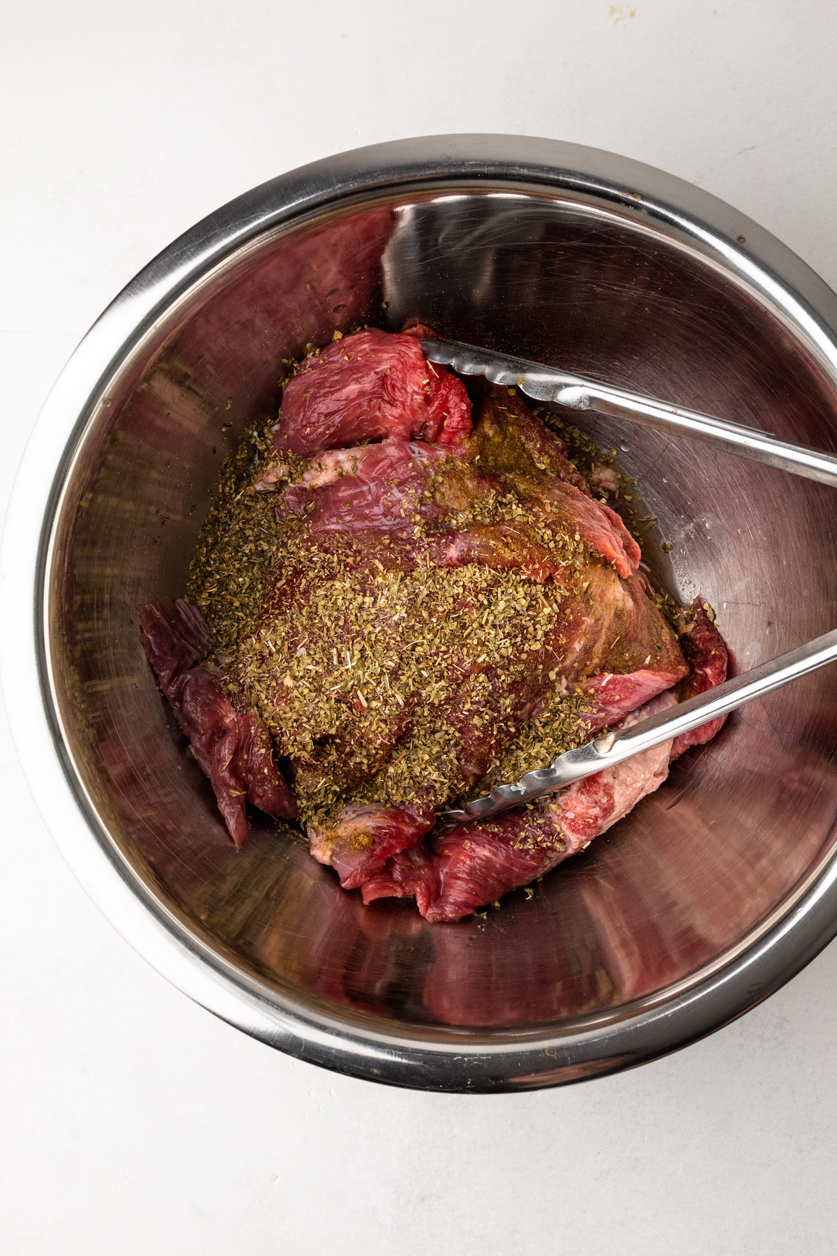 Marinating meat for carne bistec.