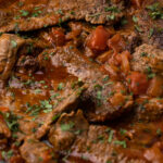 A close up of carne en bistec.