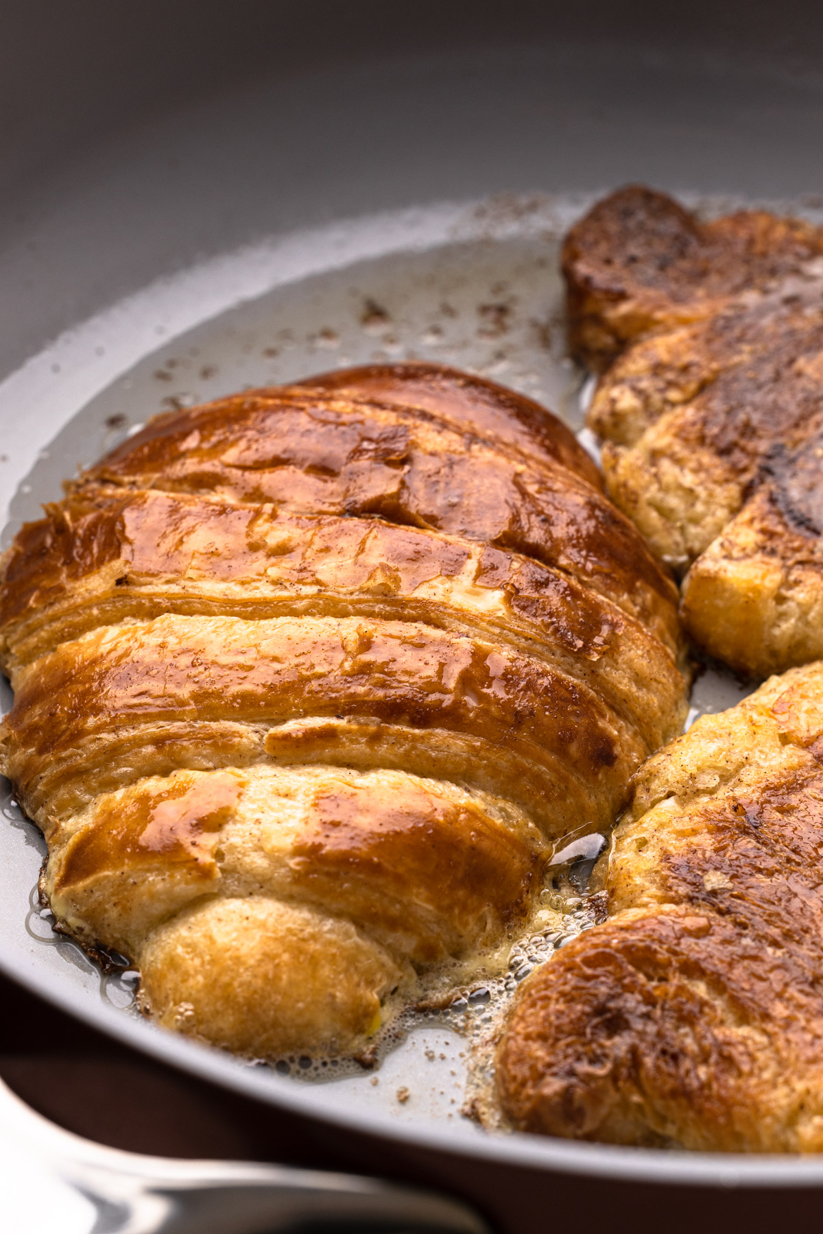 Cooking croissant french toast.