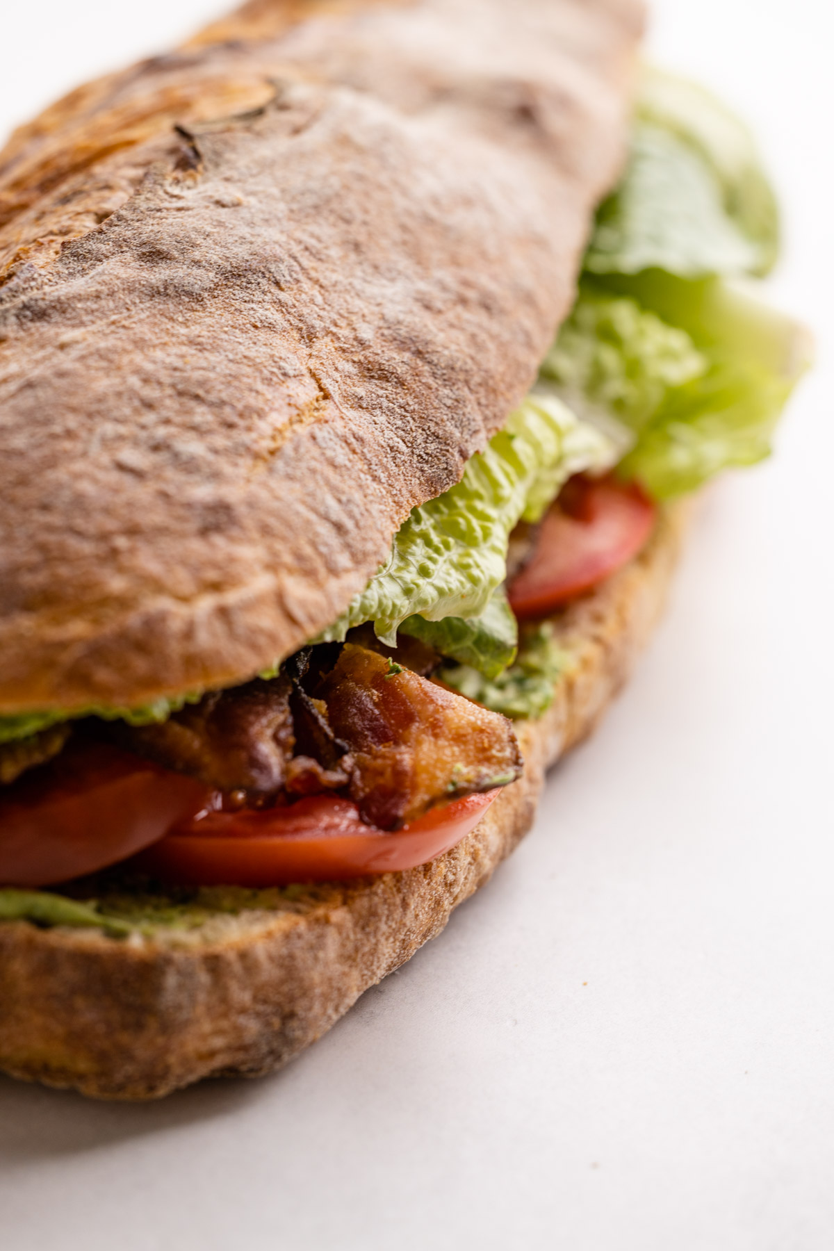 A blt with avocado family style sandwich.