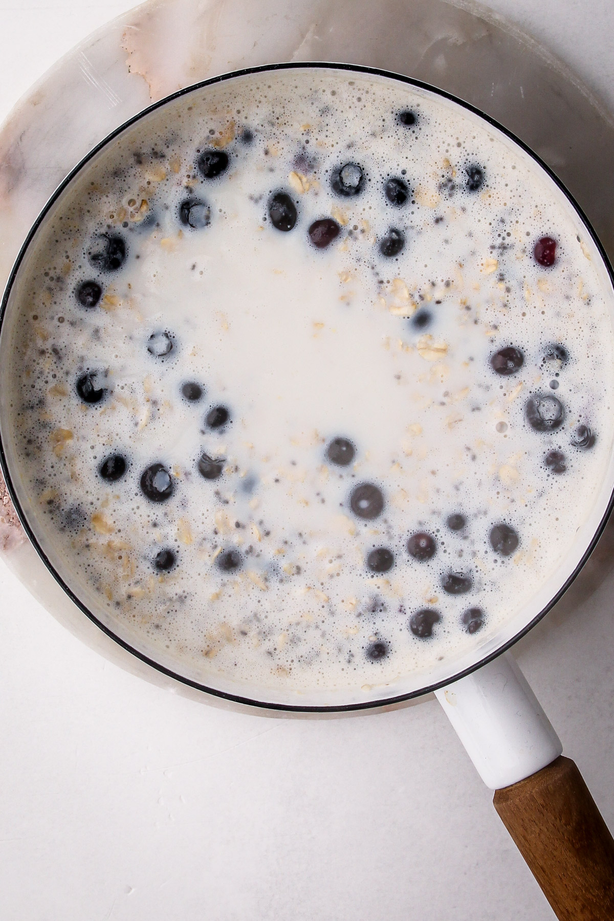 Cooking blueberry oatmeal.