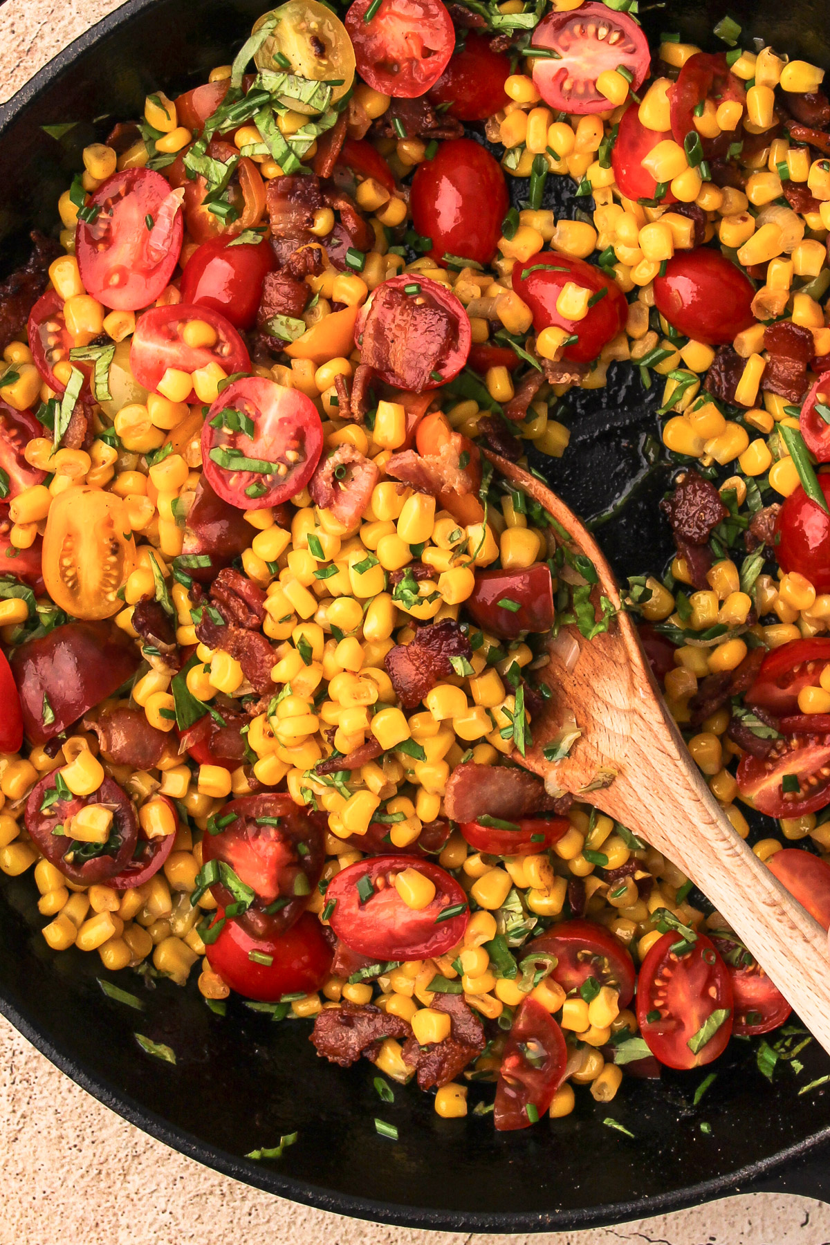 All the ingredients for corn succotash in a skillet.