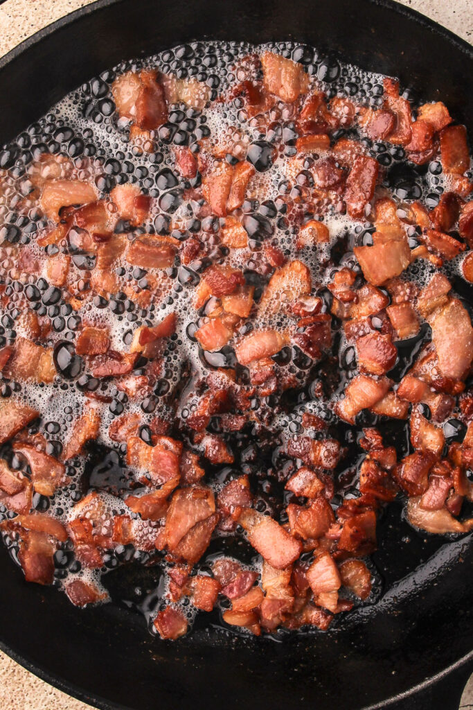 Bacon crisped in the pan.