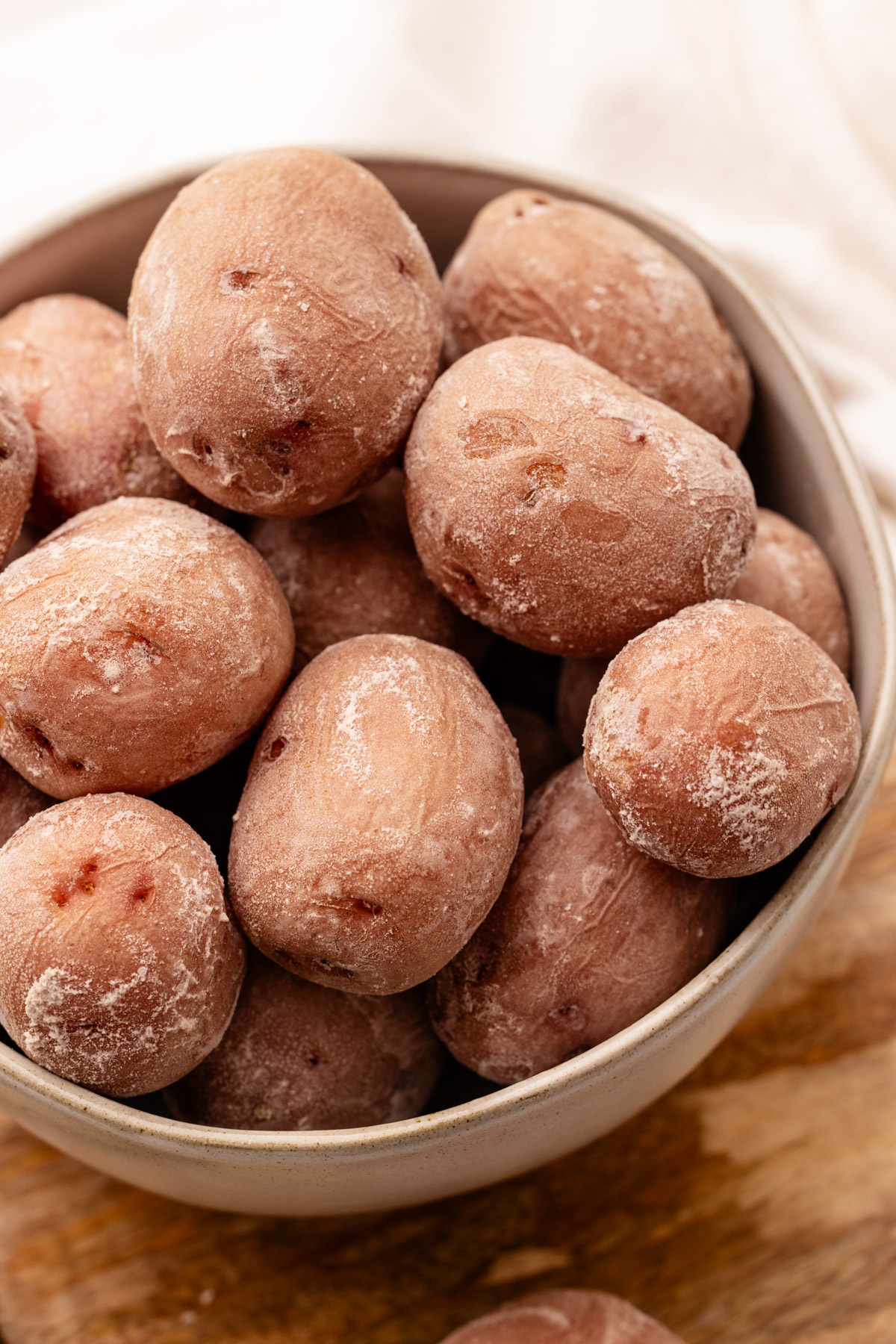 A bowl filled with salted potatoes.