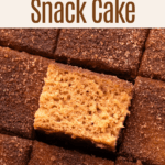 A baked and sliced apple cider donut cake.