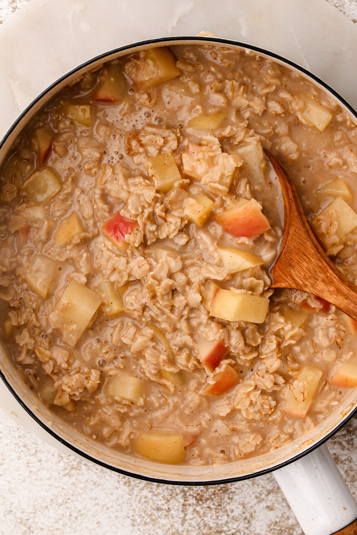 Cooked apple oatmeal in a pot.