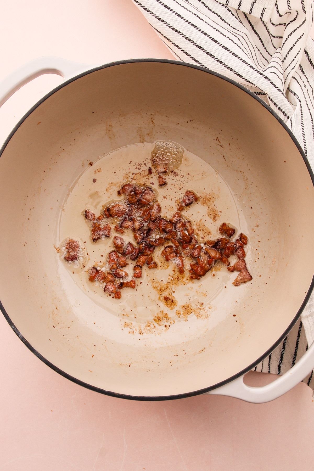 Cooked chopped bacon in a Dutch oven for Broccoli Cheddar Bacon Soup.