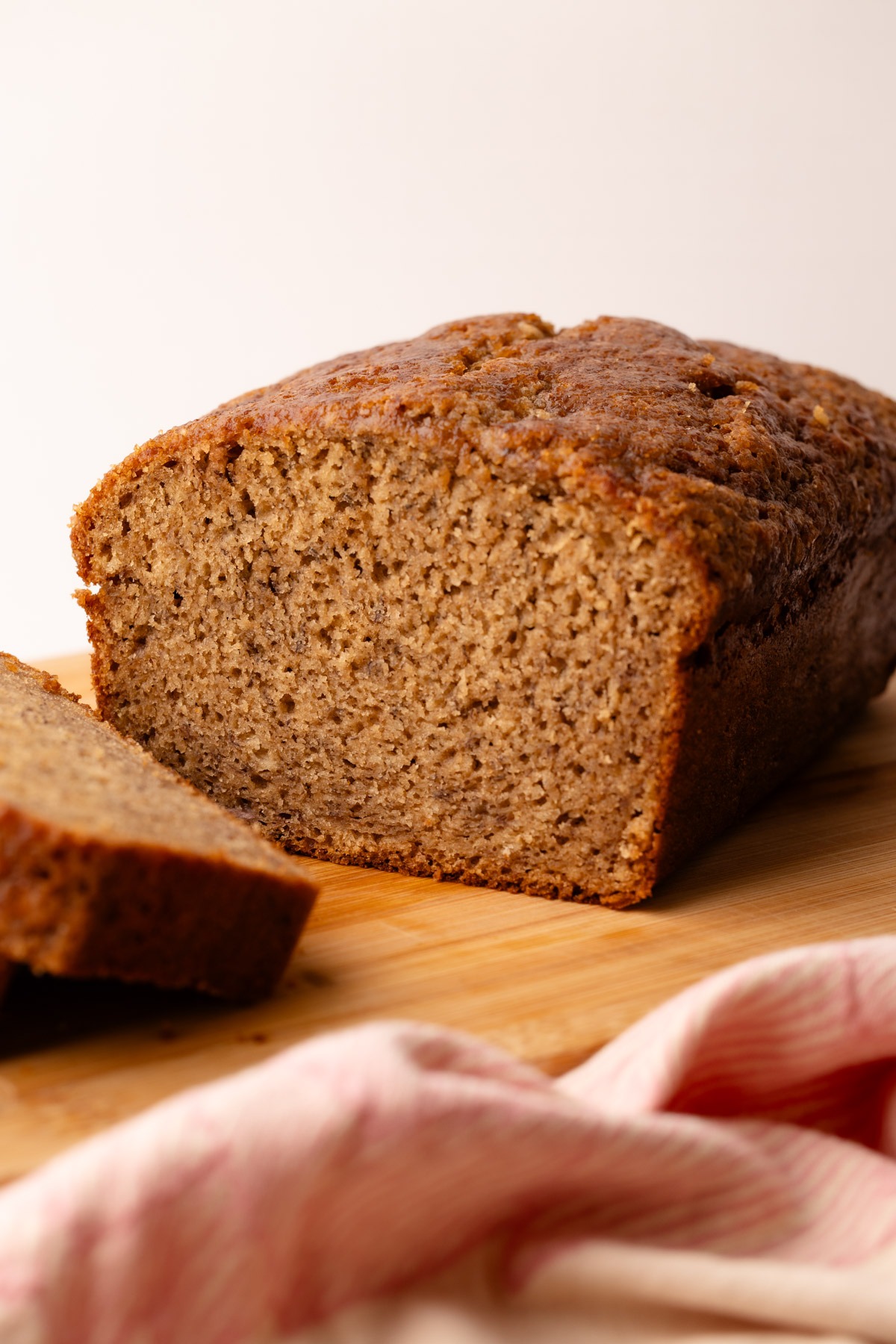 A baked perfect loaf of banana bread made in one bowl.