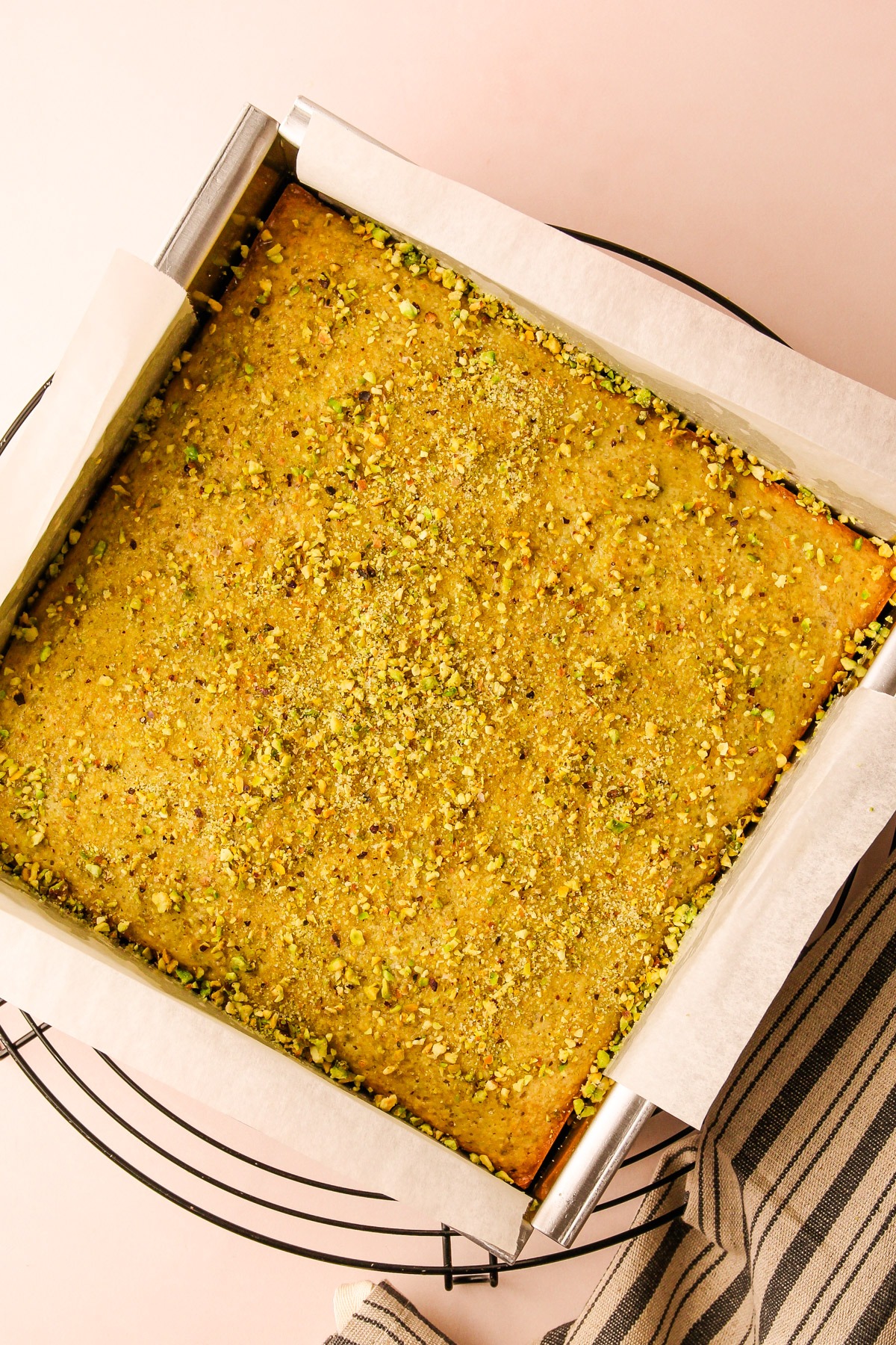 A baked and decorated italian pistachio snack cake.