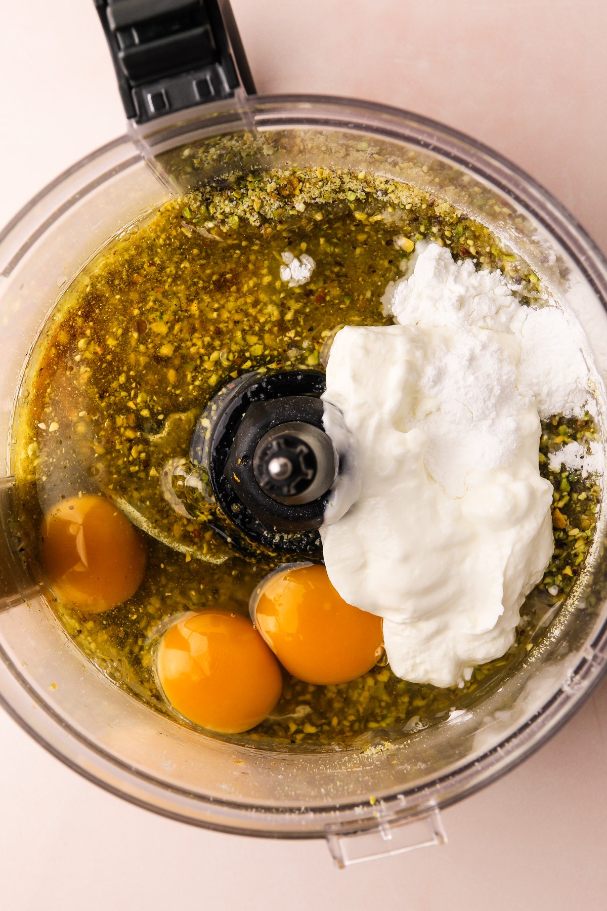 Ingredients for pistachio snack cake before being pureed in a food processor.