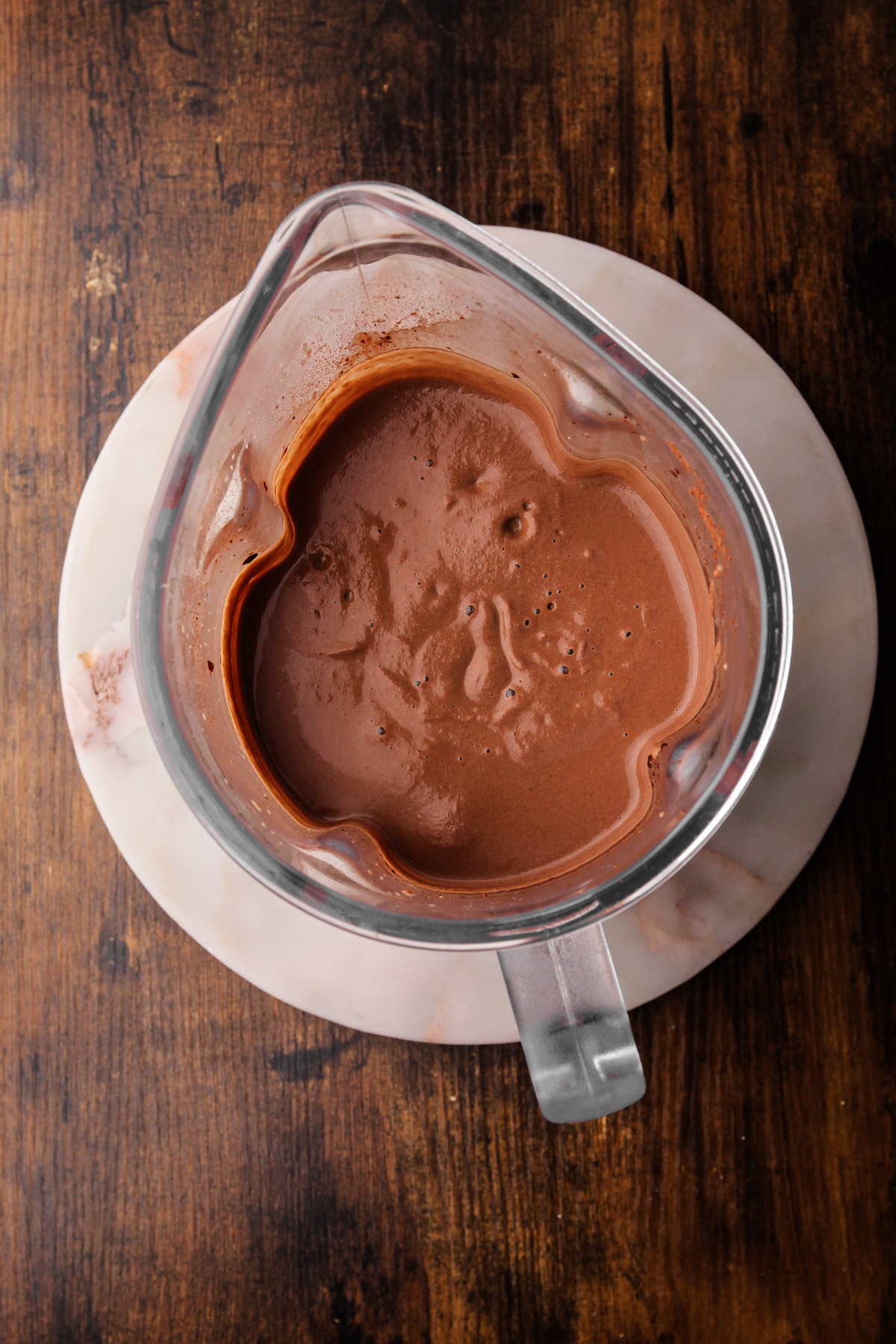 Homemade chocolate protein milk in a blender.