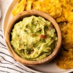 Colombian guacamole in a bowl served with tostones.