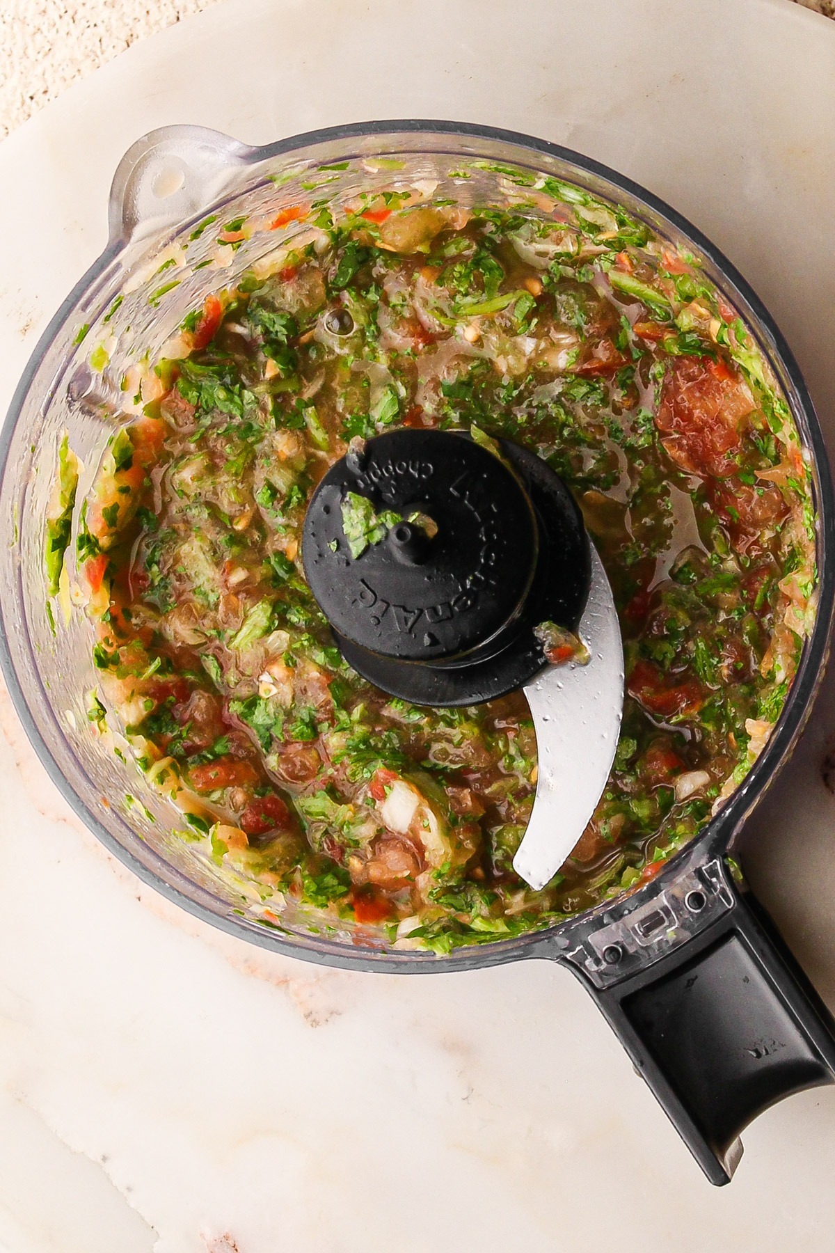 Aji chopped finely in a food processor for colombian guacamole.