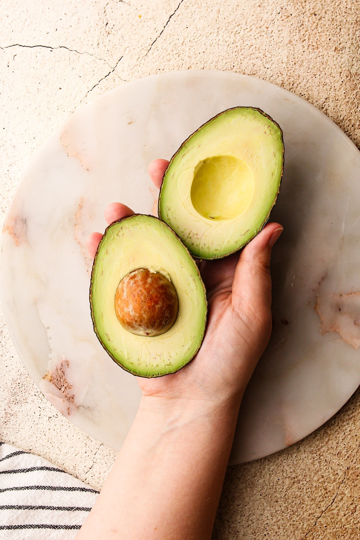 Two ripe avocados.