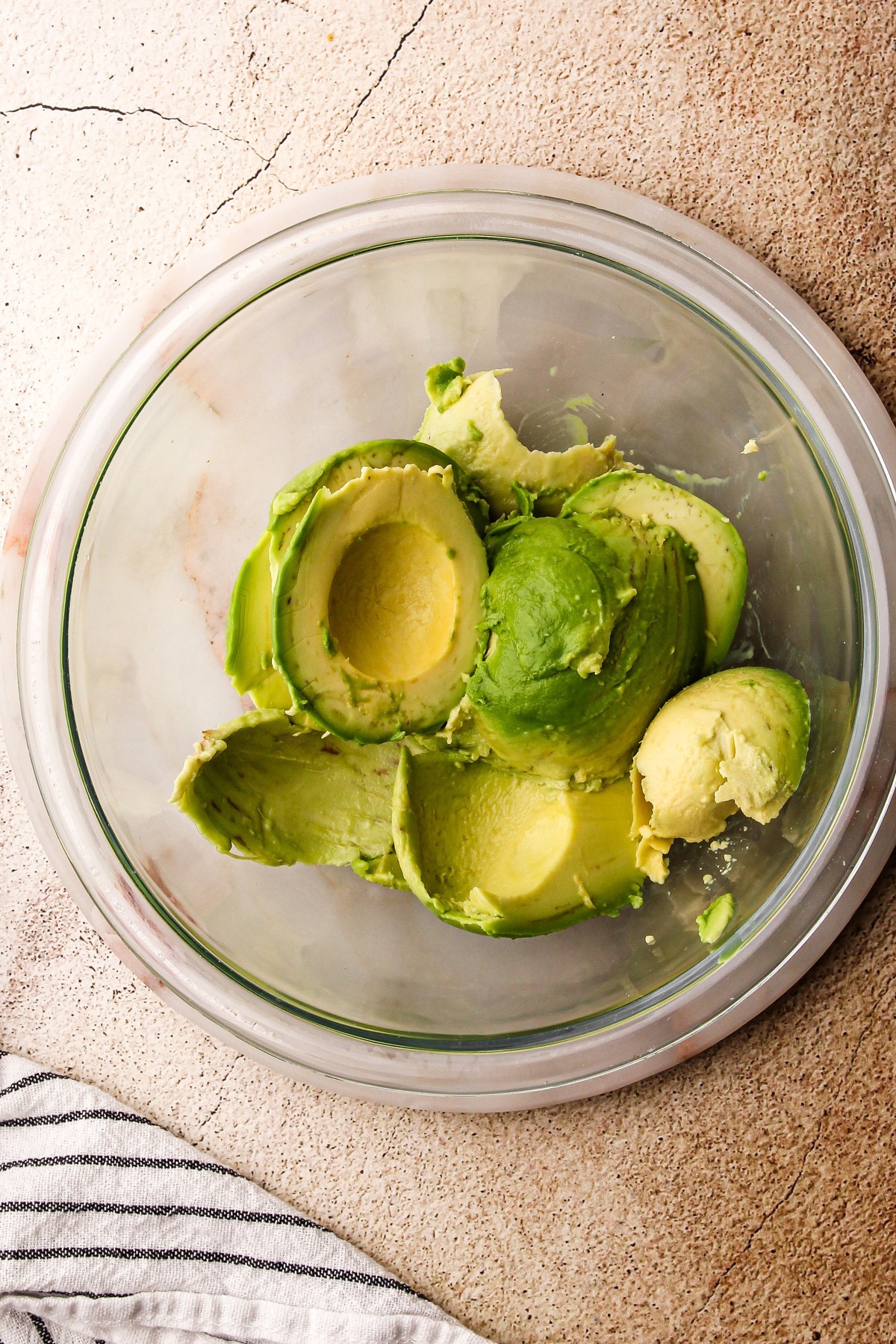 Ripe avocados in a bowl.